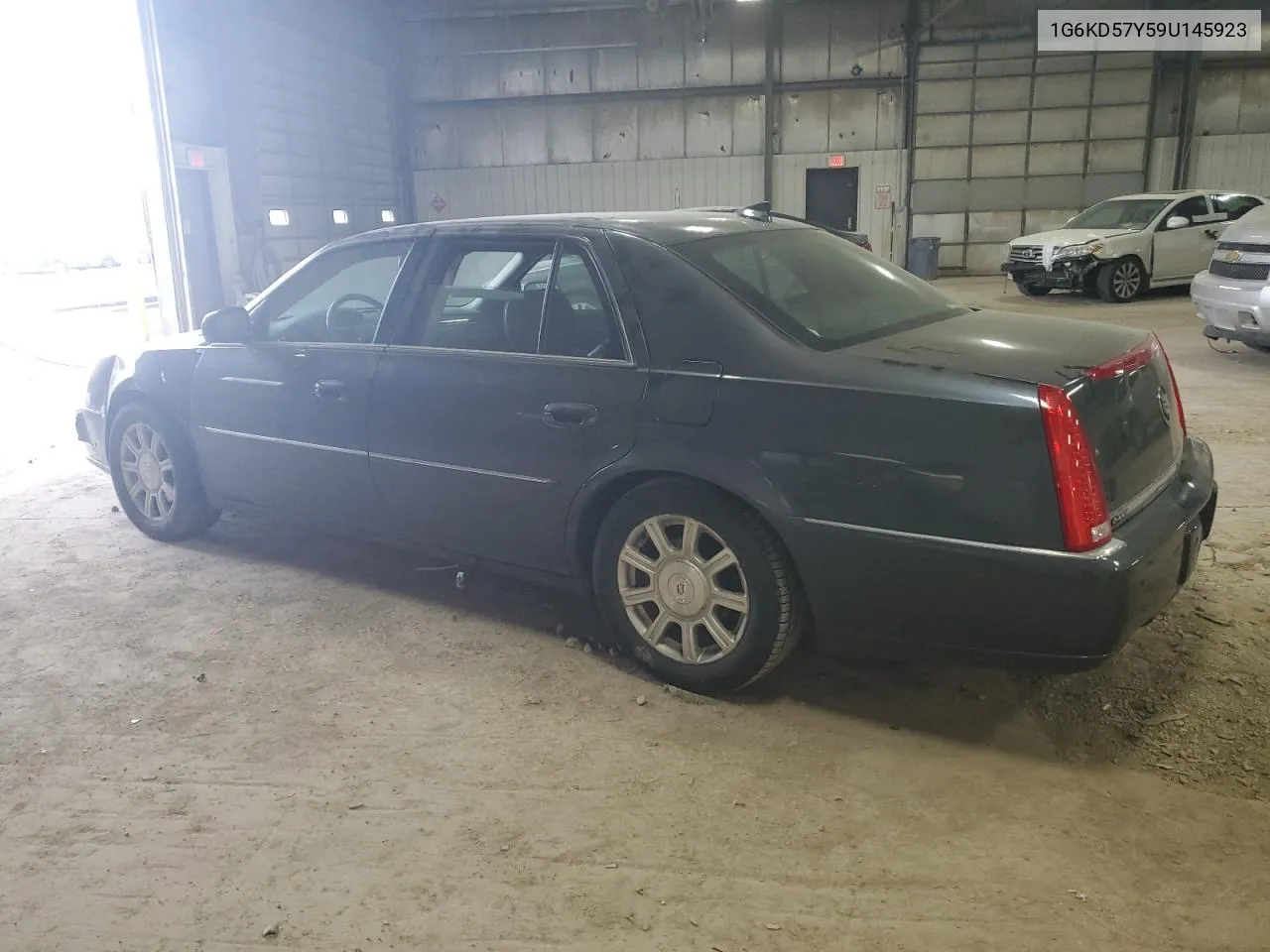 2009 Cadillac Dts VIN: 1G6KD57Y59U145923 Lot: 59552514