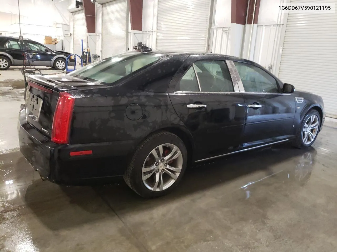 2009 Cadillac Sts VIN: 1G6DD67V590121195 Lot: 70758044