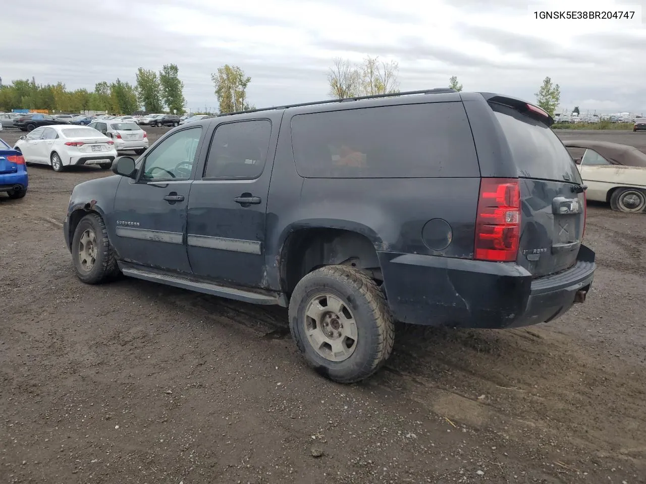 2011 Chevrolet Suburban K1500 VIN: 1GNSK5E38BR204747 Lot: 72679974