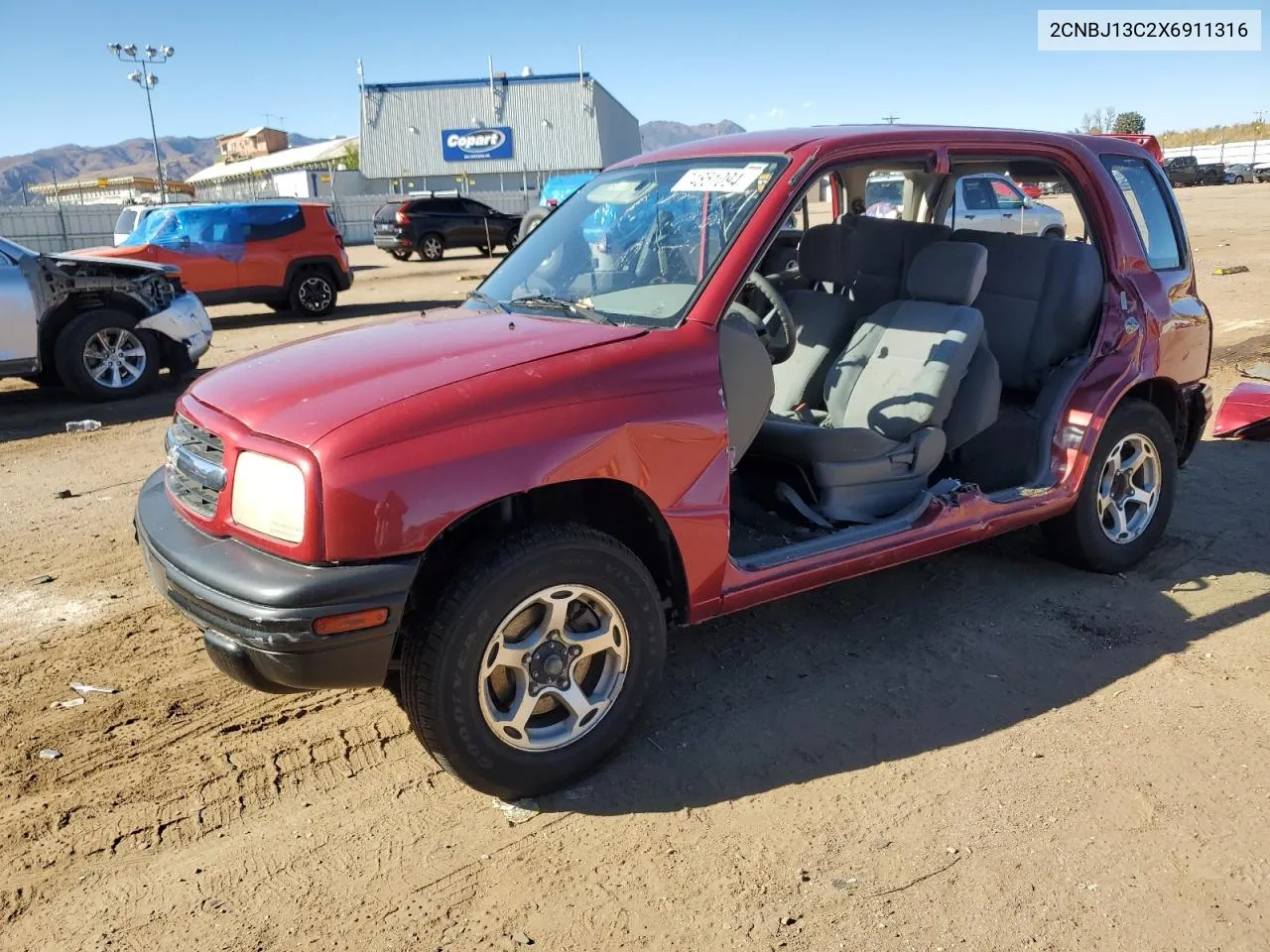 1999 Chevrolet Tracker VIN: 2CNBJ13C2X6911316 Lot: 74851094