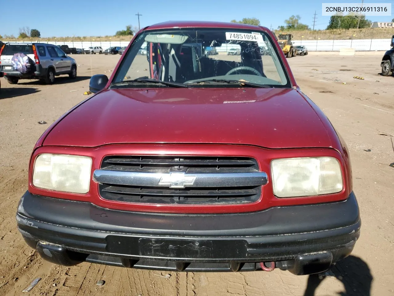 1999 Chevrolet Tracker VIN: 2CNBJ13C2X6911316 Lot: 74851094