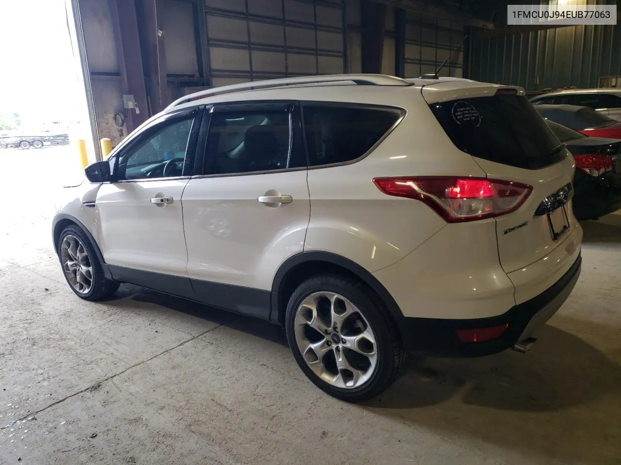 2014 Ford Escape Titanium VIN: 1FMCU0J94EUB77063 Lot: 65568104