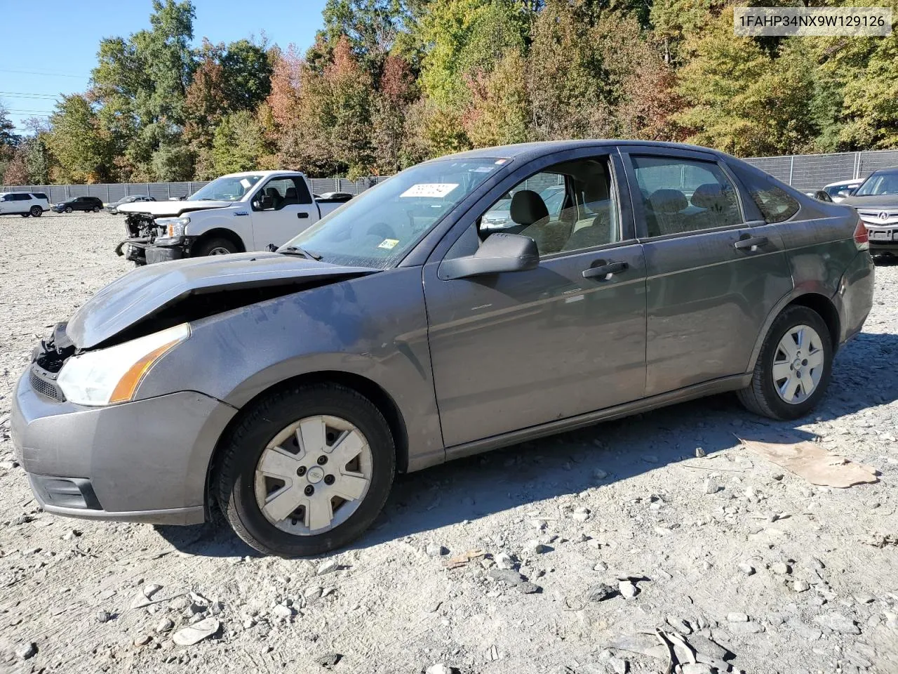 2009 Ford Focus S VIN: 1FAHP34NX9W129126 Lot: 76801094