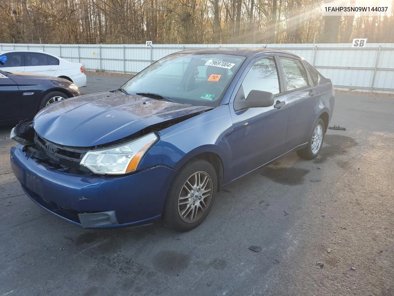 2009 Ford Focus Se VIN: 1FAHP35N09W144037 Lot: 79697004