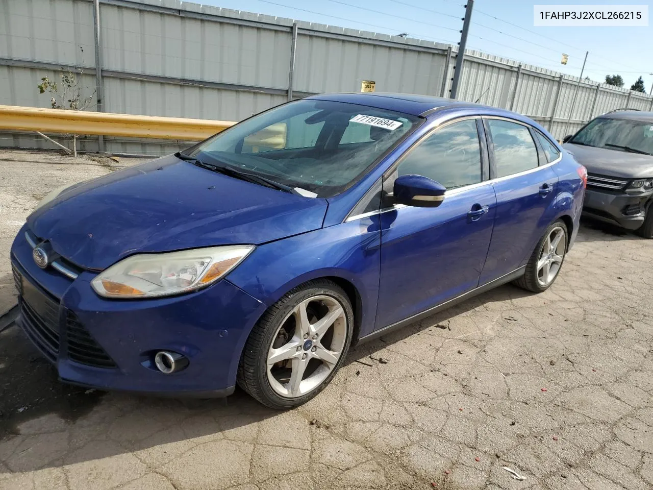 2012 Ford Focus Titanium VIN: 1FAHP3J2XCL266215 Lot: 77191694