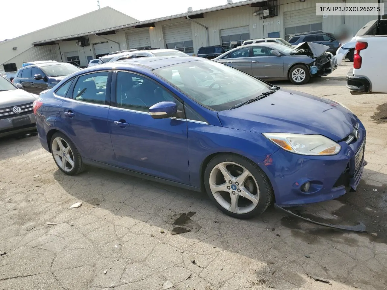 2012 Ford Focus Titanium VIN: 1FAHP3J2XCL266215 Lot: 77191694