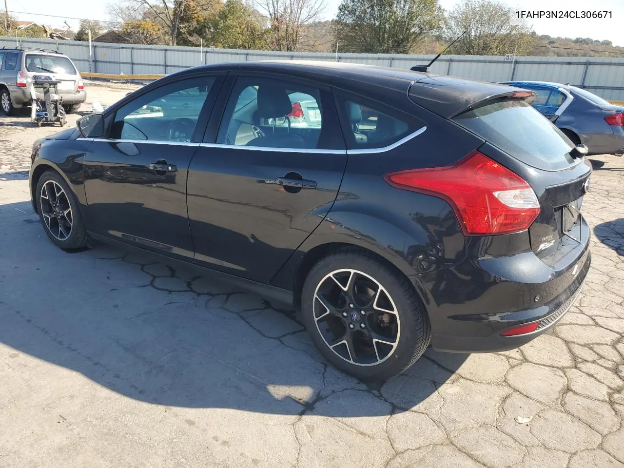 2012 Ford Focus Titanium VIN: 1FAHP3N24CL306671 Lot: 77557234