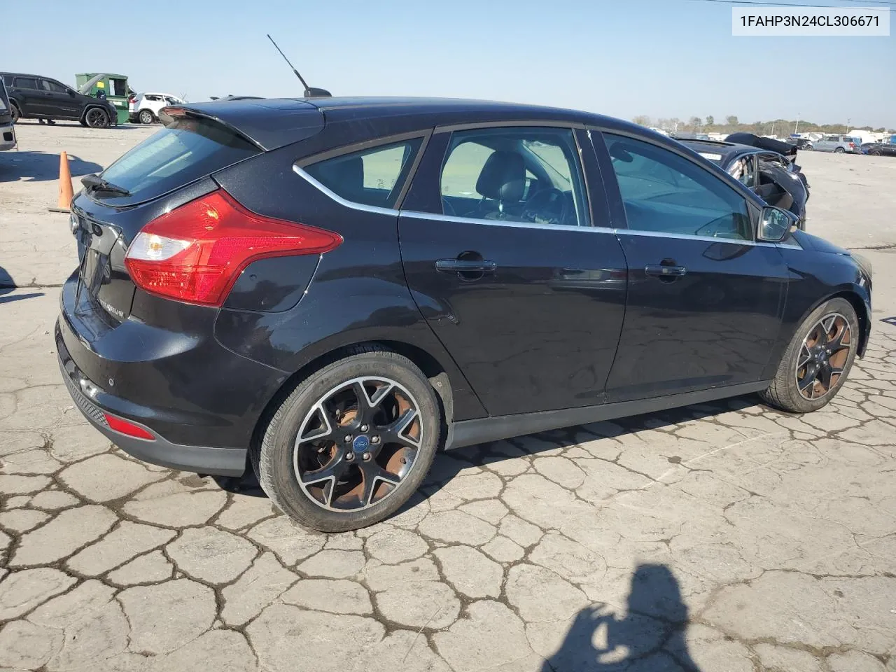 2012 Ford Focus Titanium VIN: 1FAHP3N24CL306671 Lot: 77557234