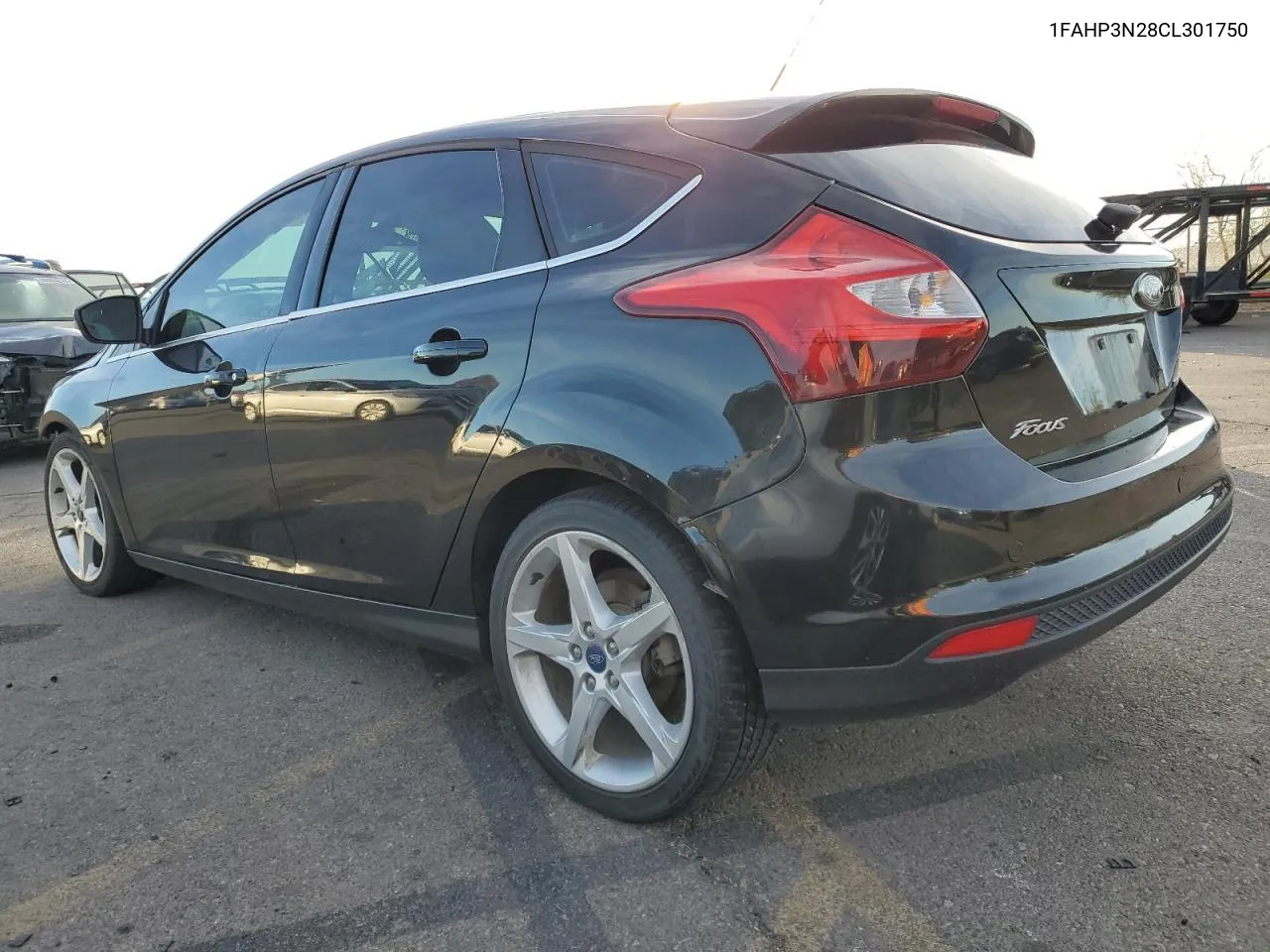 2012 Ford Focus Titanium VIN: 1FAHP3N28CL301750 Lot: 77646424