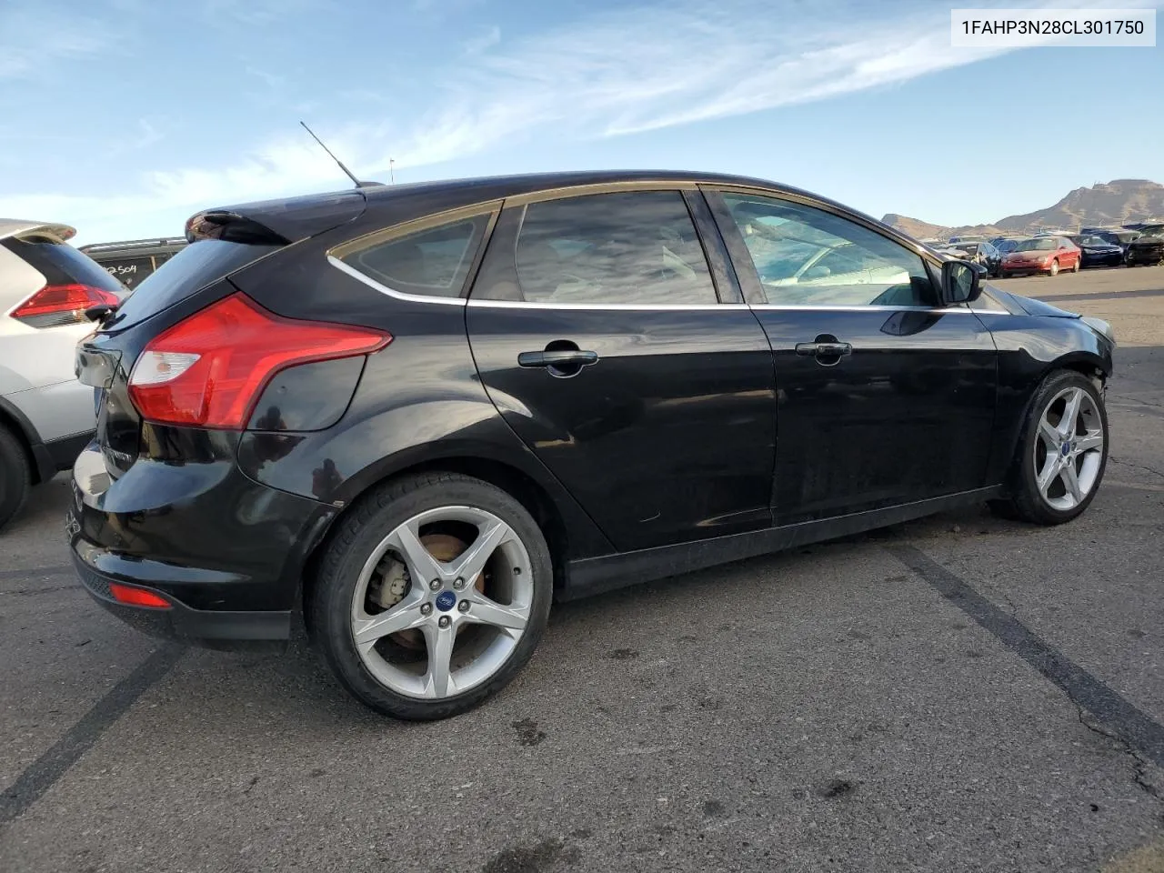 2012 Ford Focus Titanium VIN: 1FAHP3N28CL301750 Lot: 77646424