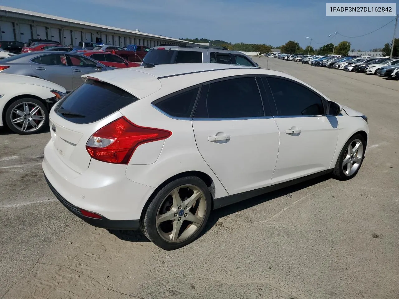 2013 Ford Focus Titanium VIN: 1FADP3N27DL162842 Lot: 68875384