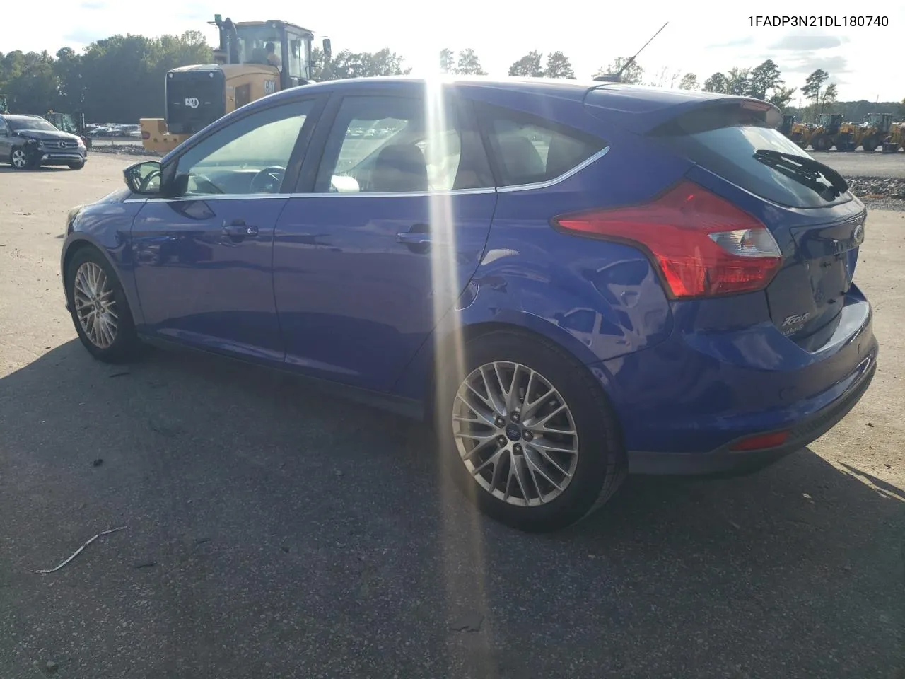 2013 Ford Focus Titanium VIN: 1FADP3N21DL180740 Lot: 74567314