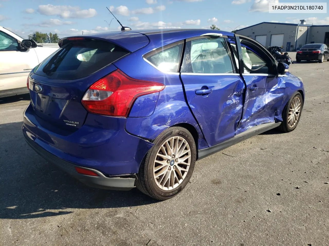 2013 Ford Focus Titanium VIN: 1FADP3N21DL180740 Lot: 74567314