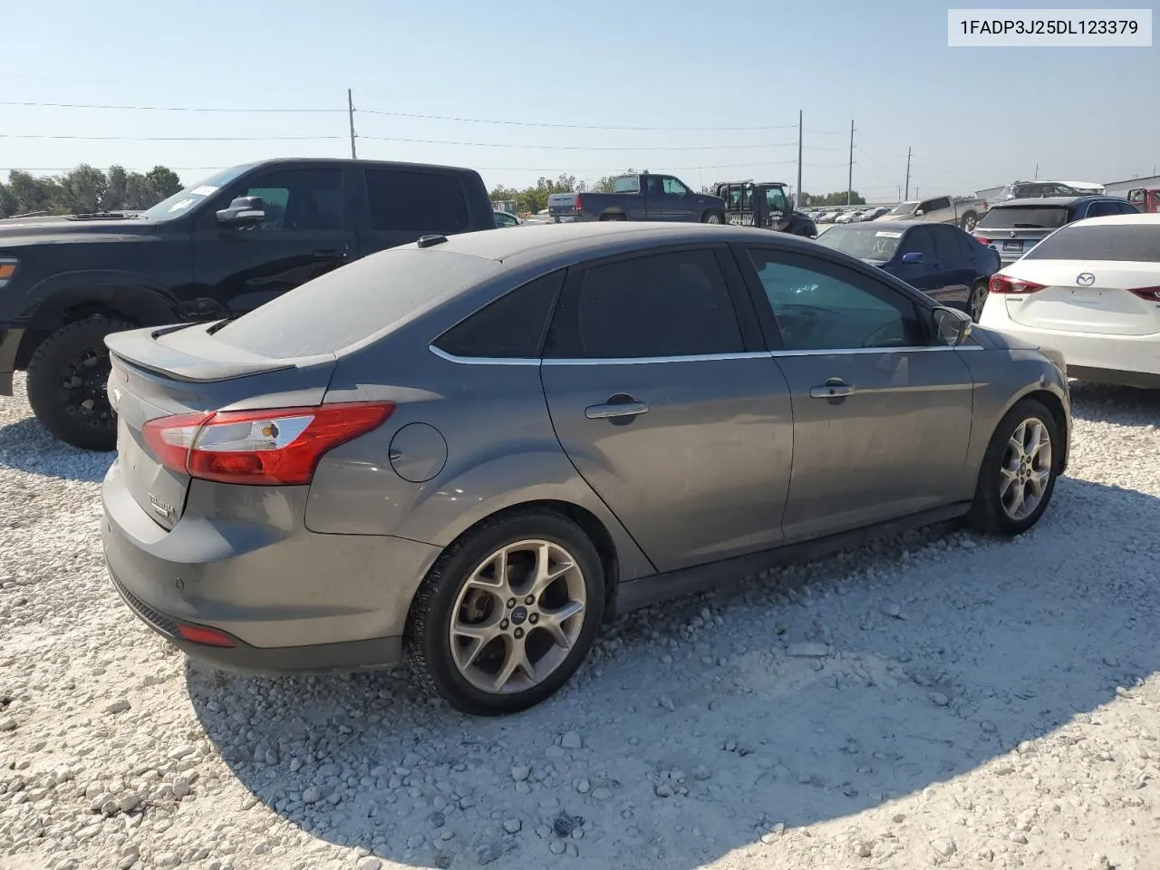 2013 Ford Focus Titanium VIN: 1FADP3J25DL123379 Lot: 75512624