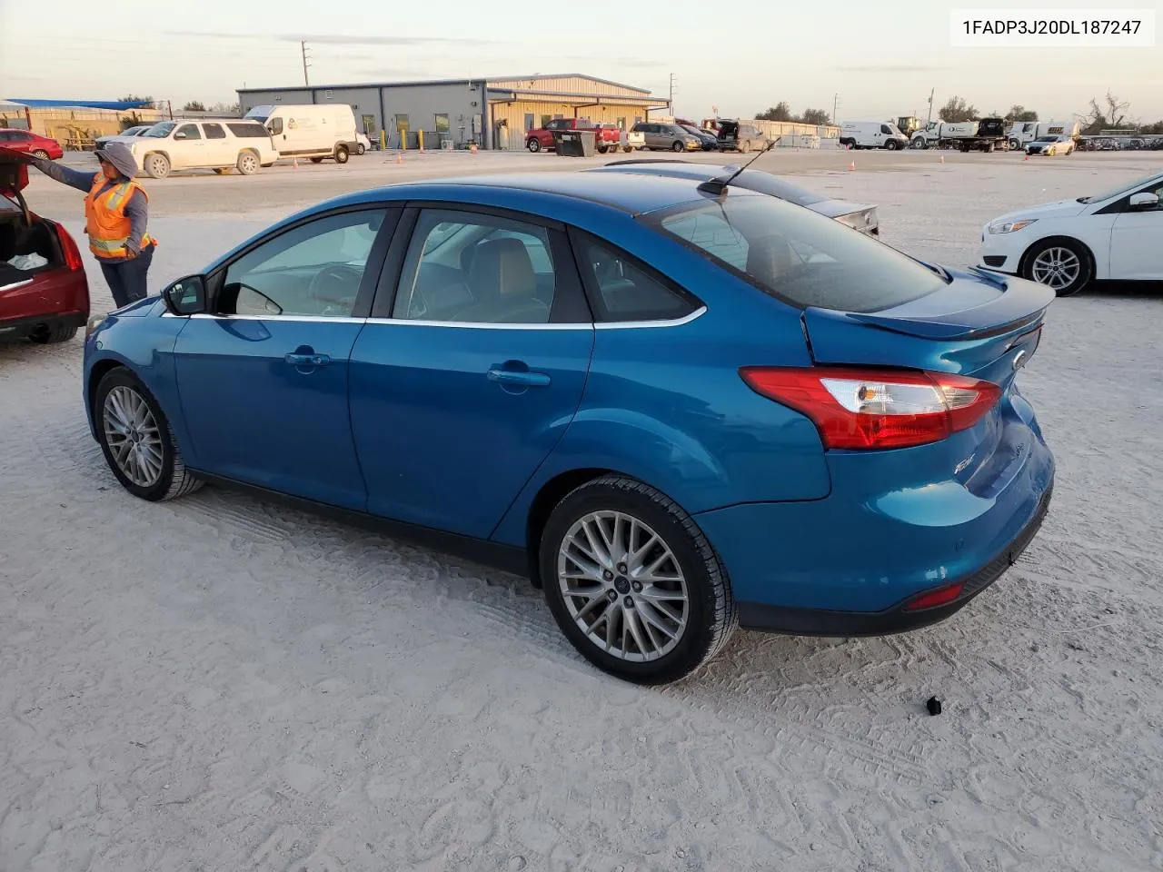 2013 Ford Focus Titanium VIN: 1FADP3J20DL187247 Lot: 77479344