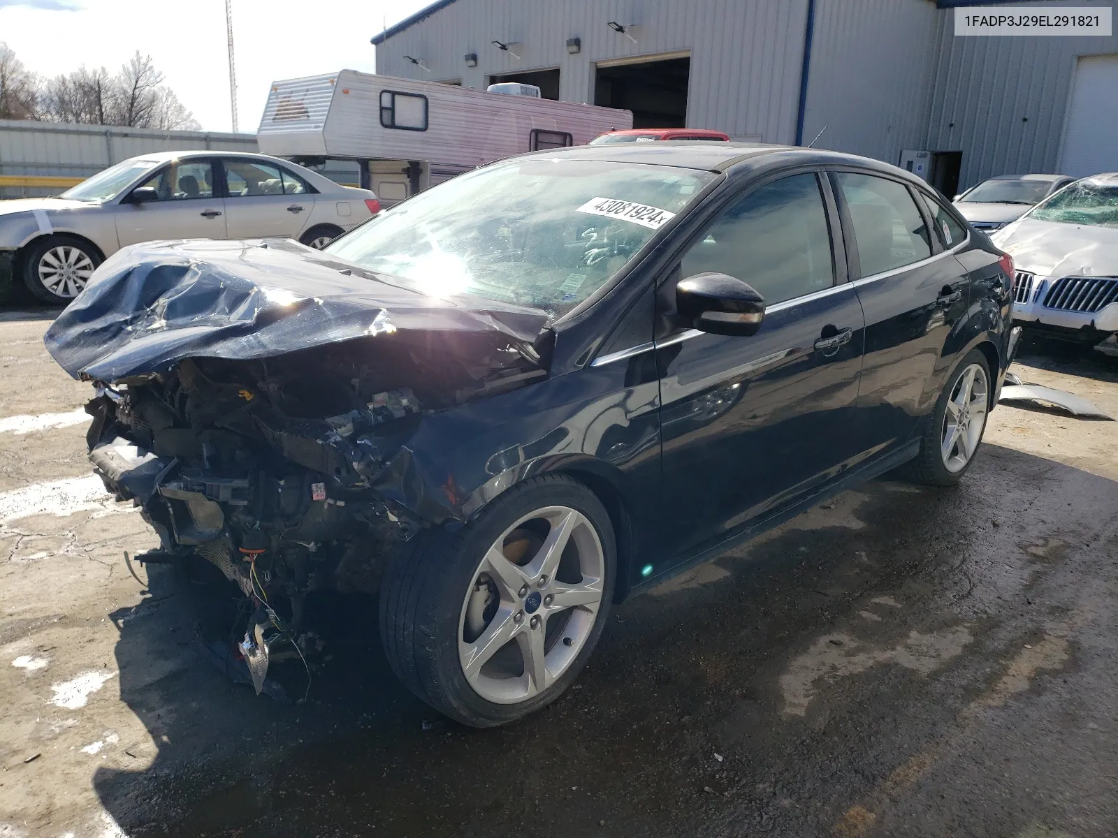 2014 Ford Focus Titanium VIN: 1FADP3J29EL291821 Lot: 43081924