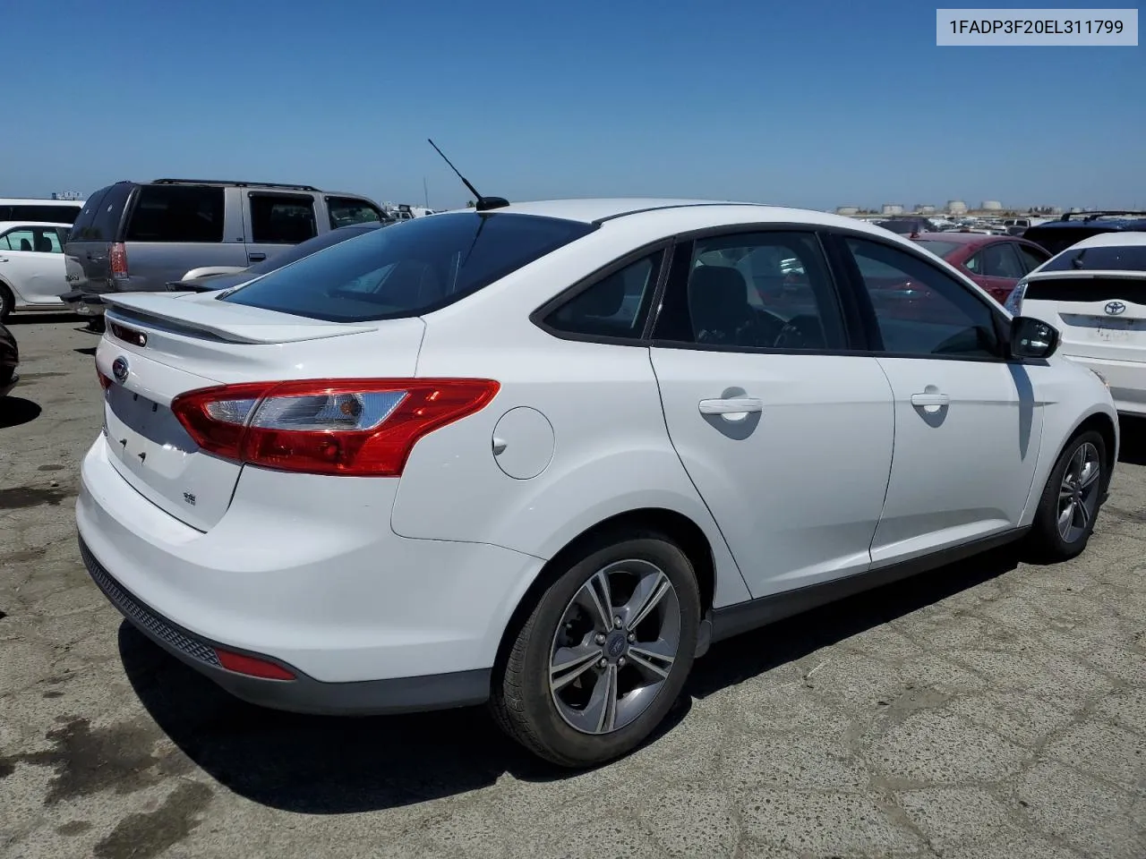 2014 Ford Focus Se VIN: 1FADP3F20EL311799 Lot: 58778604