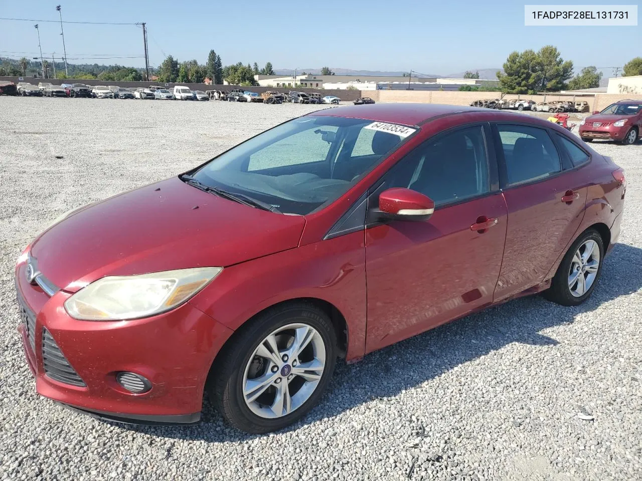 2014 Ford Focus Se VIN: 1FADP3F28EL131731 Lot: 64103534