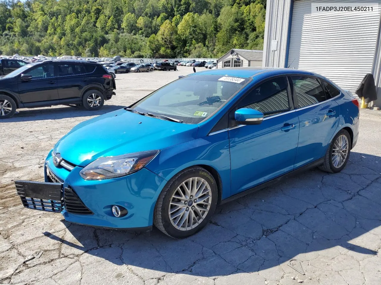 2014 Ford Focus Titanium VIN: 1FADP3J20EL450211 Lot: 70139344