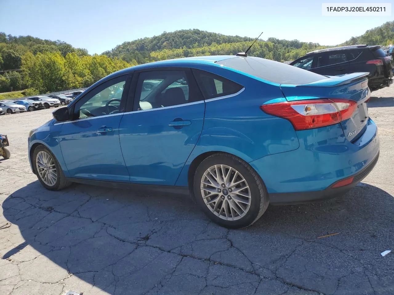 2014 Ford Focus Titanium VIN: 1FADP3J20EL450211 Lot: 70139344