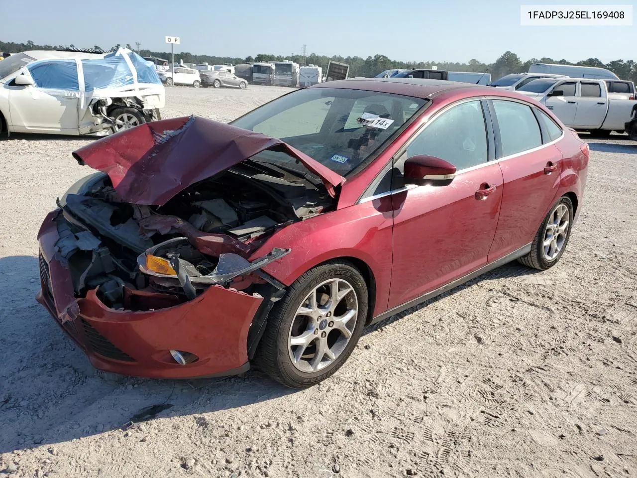 2014 Ford Focus Titanium VIN: 1FADP3J25EL169408 Lot: 73581114