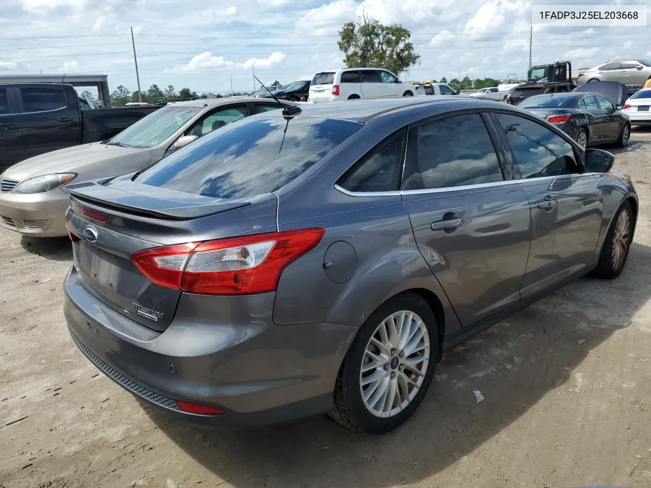 2014 Ford Focus Titanium VIN: 1FADP3J25EL203668 Lot: 74076604