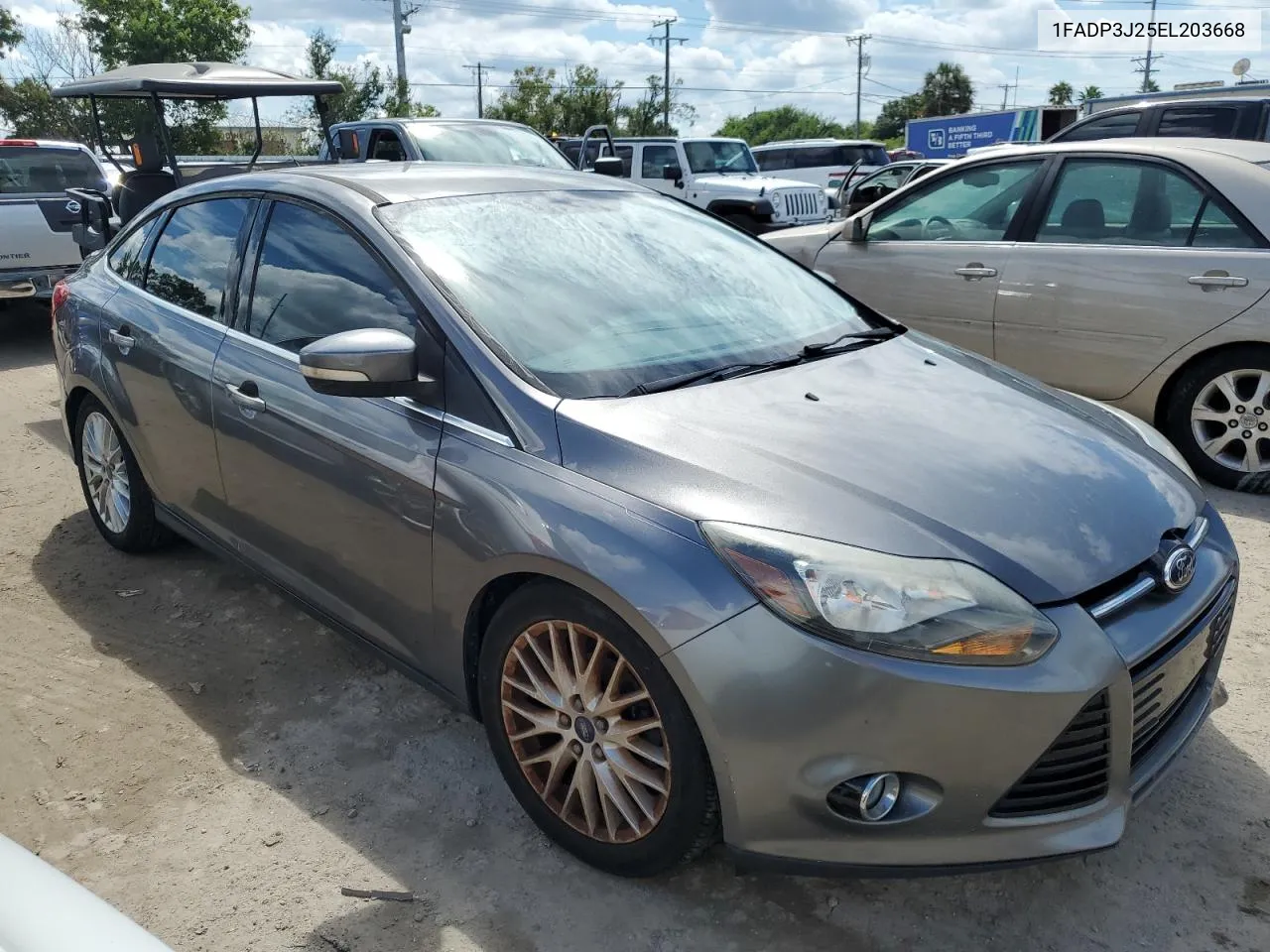 2014 Ford Focus Titanium VIN: 1FADP3J25EL203668 Lot: 74076604