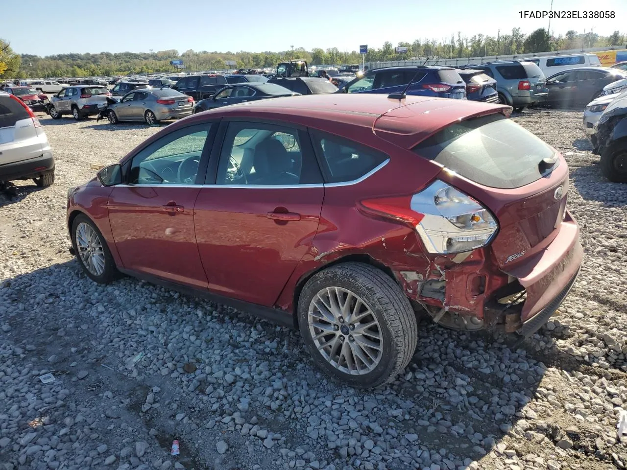 2014 Ford Focus Titanium VIN: 1FADP3N23EL338058 Lot: 74359204