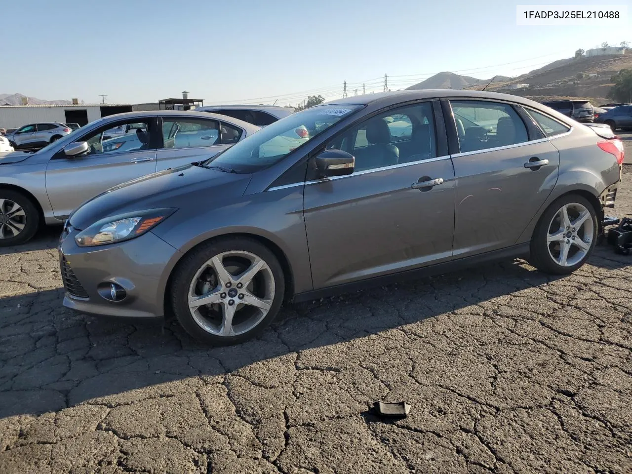 2014 Ford Focus Titanium VIN: 1FADP3J25EL210488 Lot: 75741454