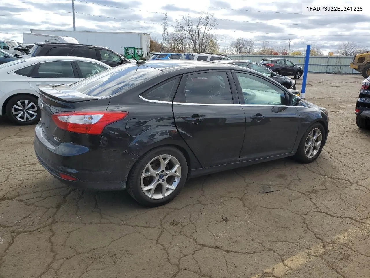 2014 Ford Focus Titanium VIN: 1FADP3J22EL241228 Lot: 78575794