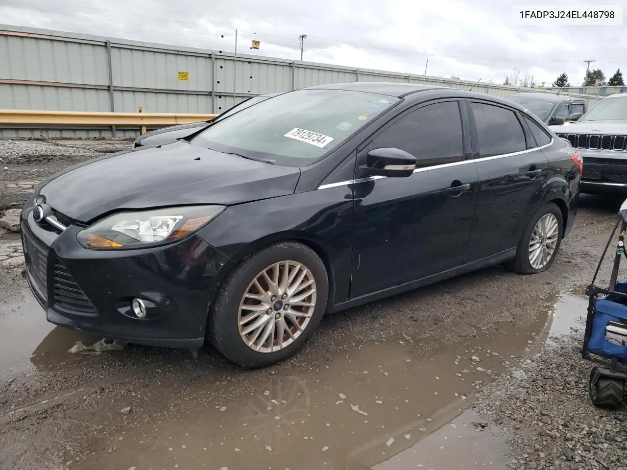 2014 Ford Focus Titanium VIN: 1FADP3J24EL448798 Lot: 79129734