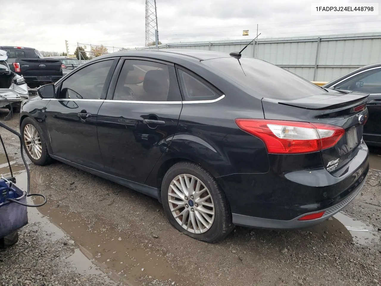 2014 Ford Focus Titanium VIN: 1FADP3J24EL448798 Lot: 79129734