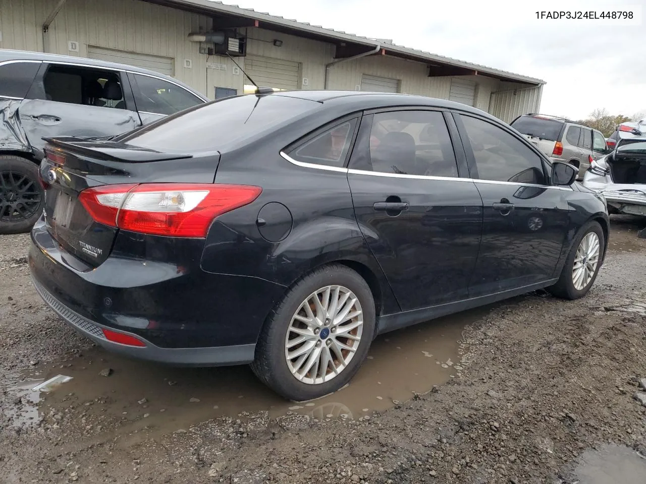 2014 Ford Focus Titanium VIN: 1FADP3J24EL448798 Lot: 79129734