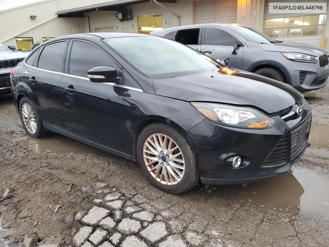 2014 Ford Focus Titanium VIN: 1FADP3J24EL448798 Lot: 79129734