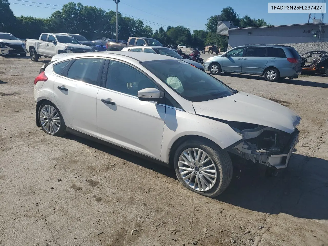 2015 Ford Focus Titanium VIN: 1FADP3N25FL237427 Lot: 58881424