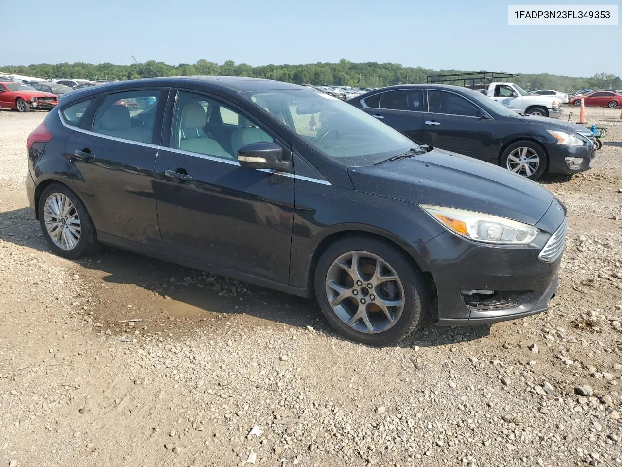 2015 Ford Focus Titanium VIN: 1FADP3N23FL349353 Lot: 63074614