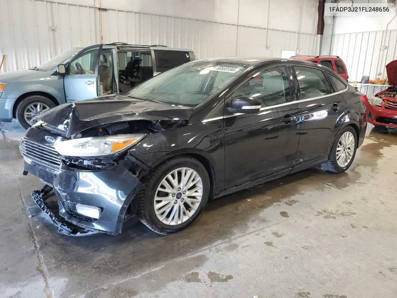 2015 Ford Focus Titanium VIN: 1FADP3J21FL248656 Lot: 68569194