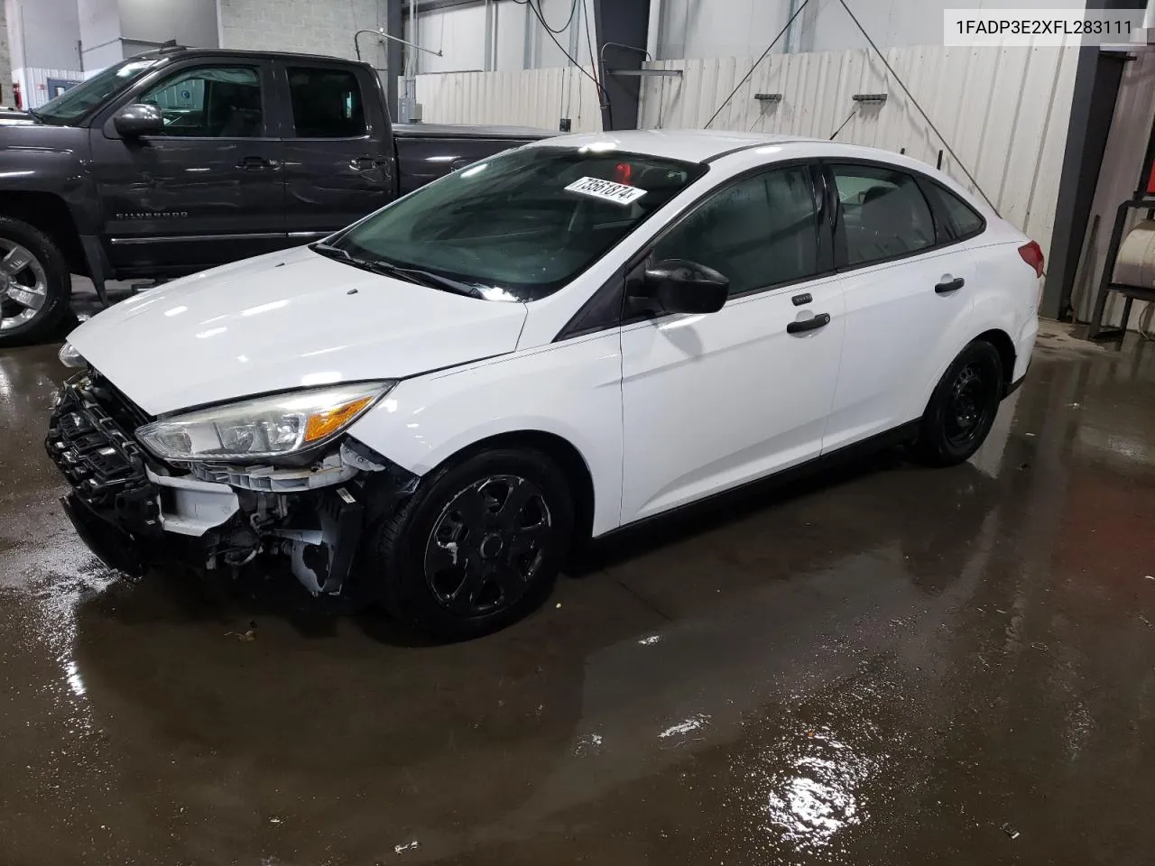 2015 Ford Focus S VIN: 1FADP3E2XFL283111 Lot: 73561874