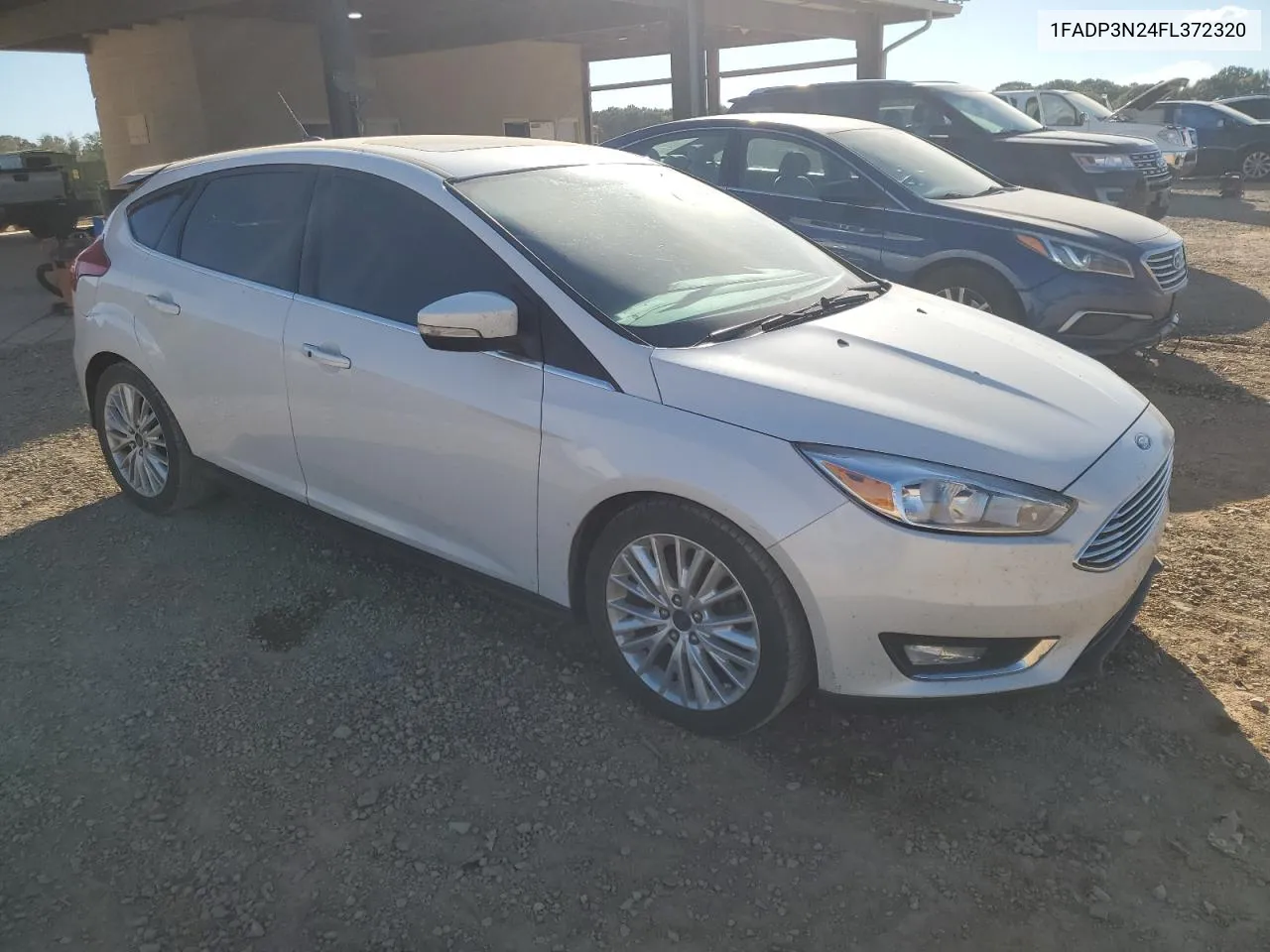 2015 Ford Focus Titanium VIN: 1FADP3N24FL372320 Lot: 76479154