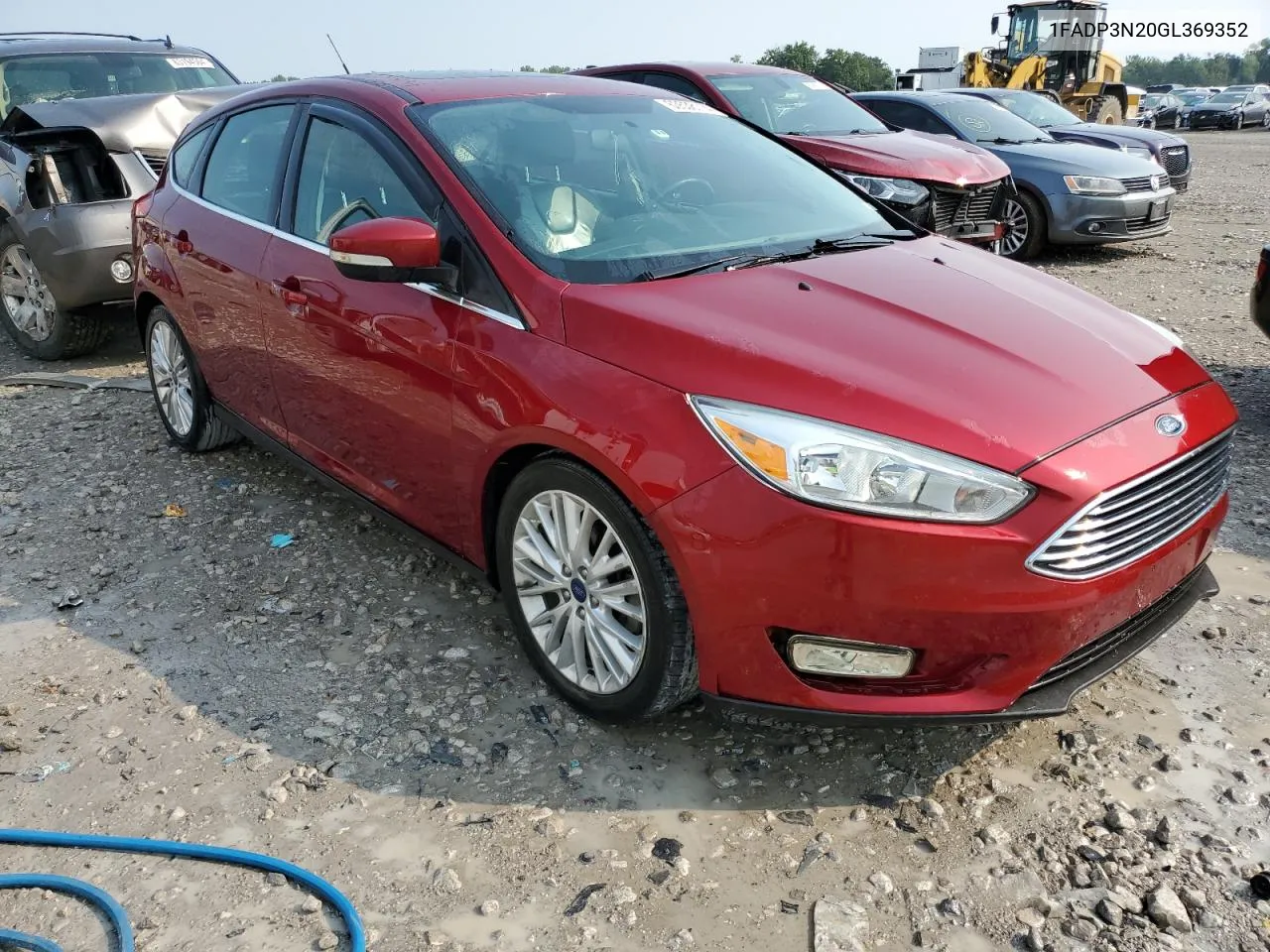 2016 Ford Focus Titanium VIN: 1FADP3N20GL369352 Lot: 63538114