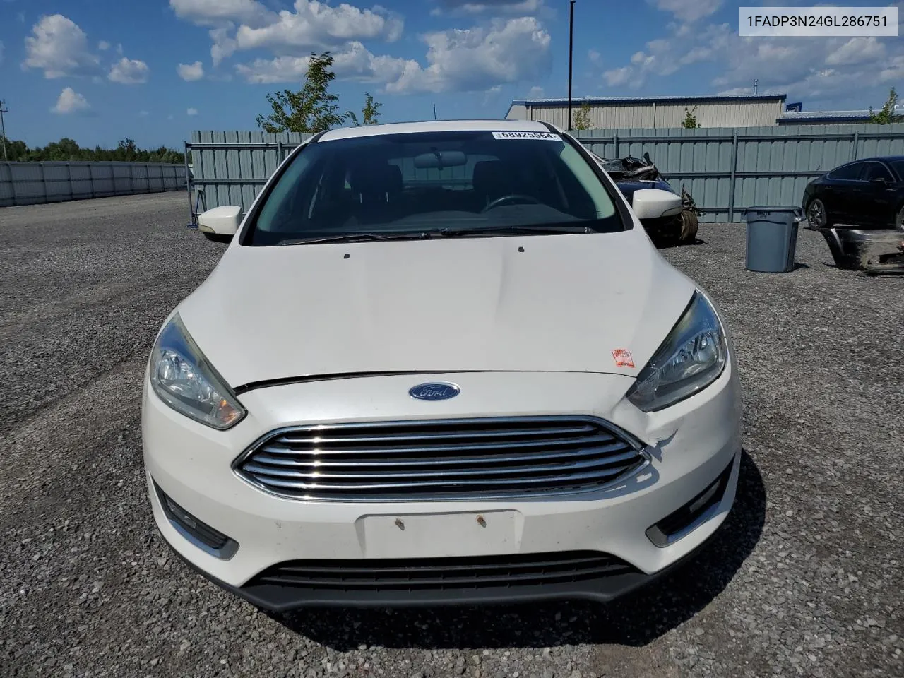 2016 Ford Focus Titanium VIN: 1FADP3N24GL286751 Lot: 68925564