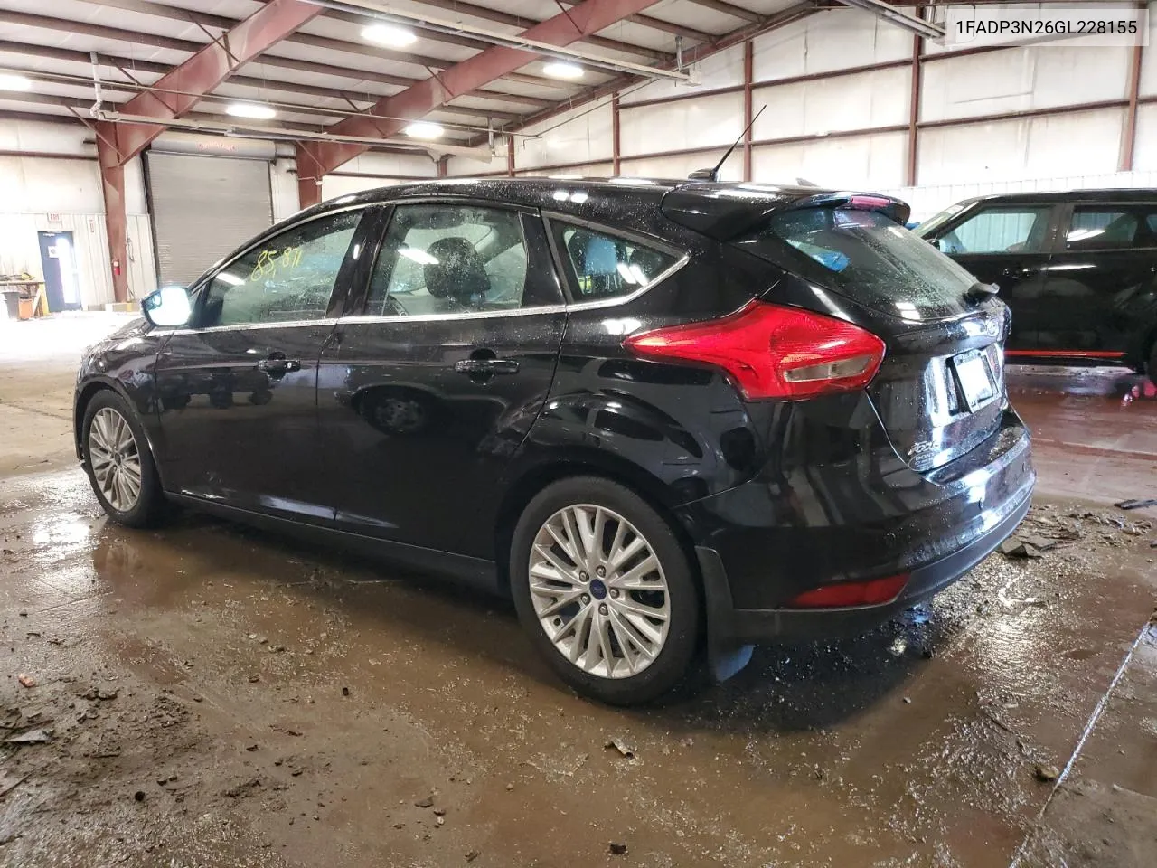 2016 Ford Focus Titanium VIN: 1FADP3N26GL228155 Lot: 71077844