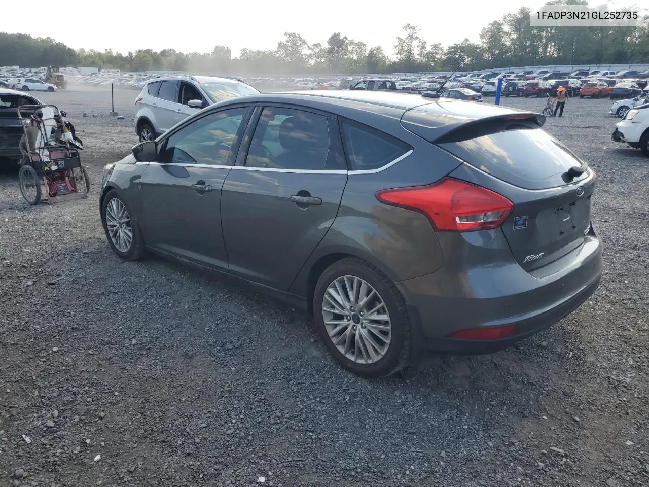 2016 Ford Focus Titanium VIN: 1FADP3N21GL252735 Lot: 71211814