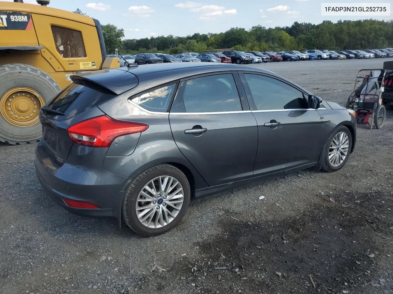 2016 Ford Focus Titanium VIN: 1FADP3N21GL252735 Lot: 71211814