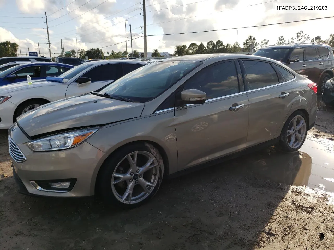 2016 Ford Focus Titanium VIN: 1FADP3J24GL219203 Lot: 73720004