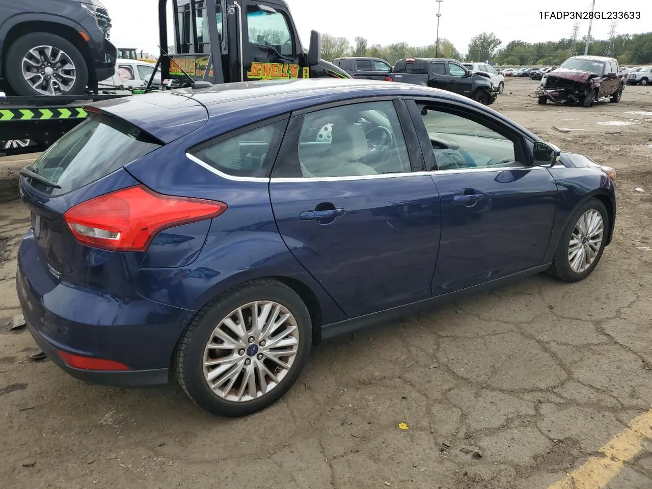 2016 Ford Focus Titanium VIN: 1FADP3N28GL233633 Lot: 73802184