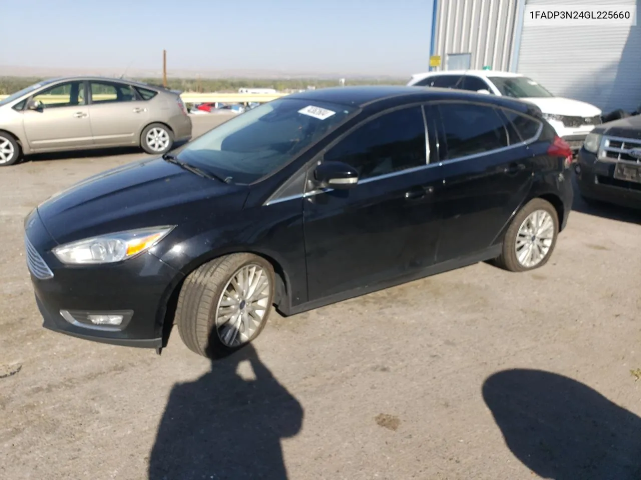 2016 Ford Focus Titanium VIN: 1FADP3N24GL225660 Lot: 74362604