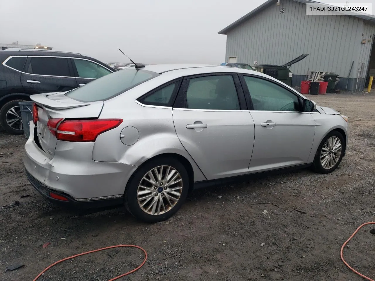 2016 Ford Focus Titanium VIN: 1FADP3J21GL243247 Lot: 74395874