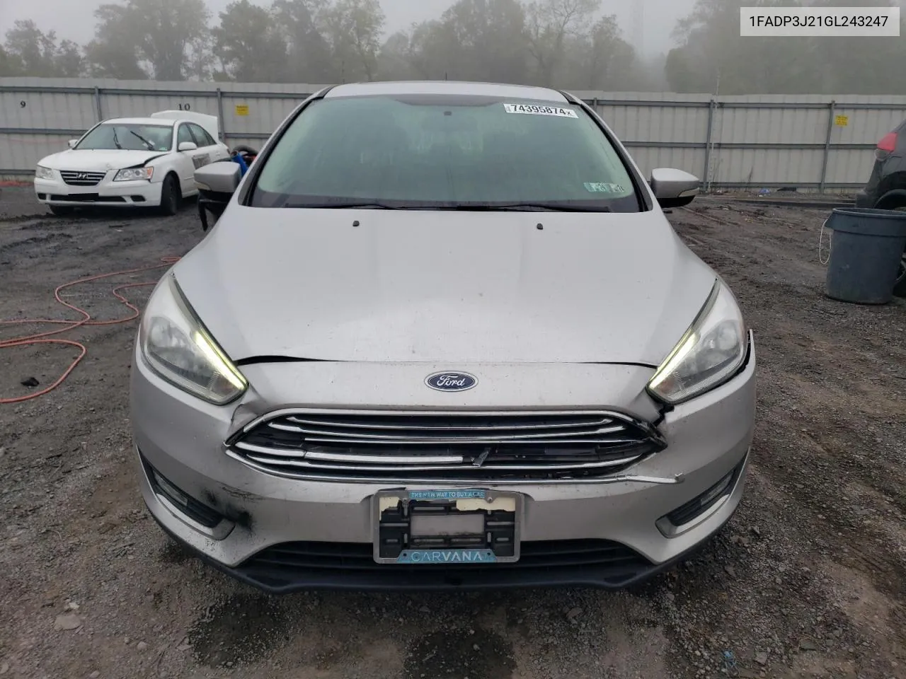 2016 Ford Focus Titanium VIN: 1FADP3J21GL243247 Lot: 74395874