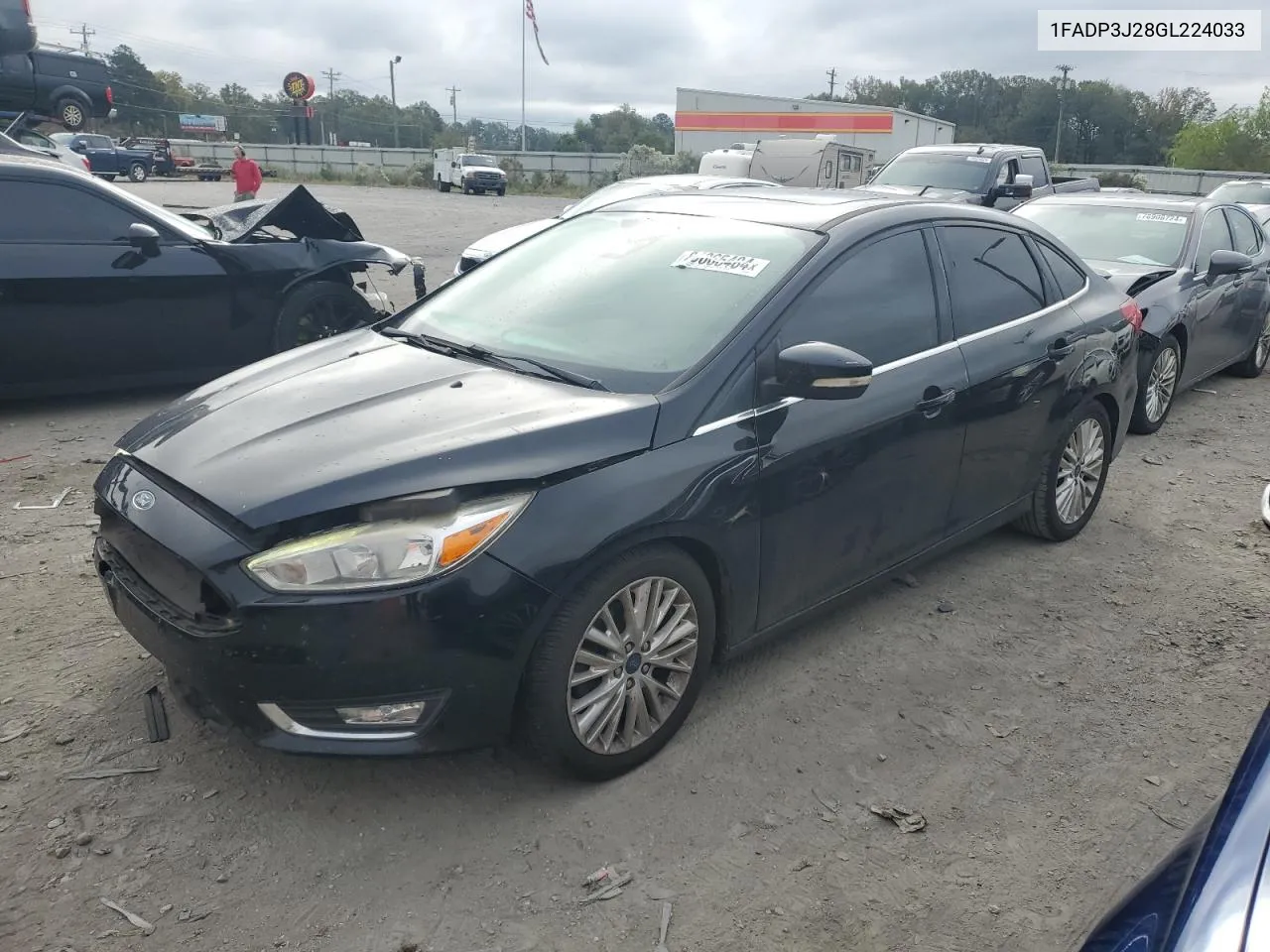 2016 Ford Focus Titanium VIN: 1FADP3J28GL224033 Lot: 80065484